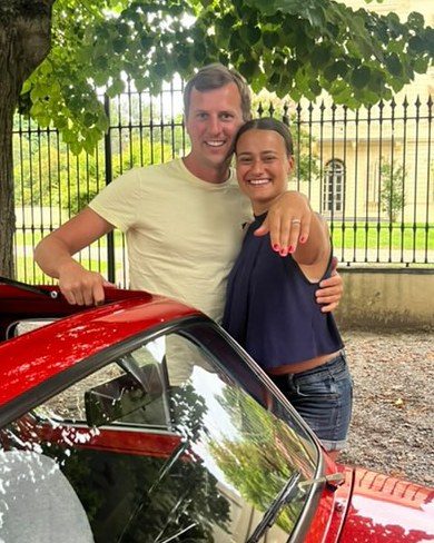 Valiant and Demelza today, beside a red classic car in Italy